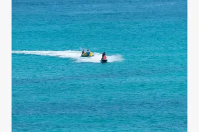 two people on a jet ski in the water at Sunbird 0208E 'Dolphin Watch' in Panama City Beach