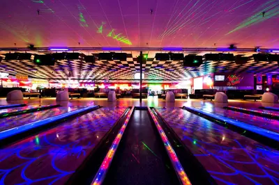 a brightly lit bowling alley with lanes and lights at Grand Panama 1-1706 'Paradise Harbor' in Panama City Beach