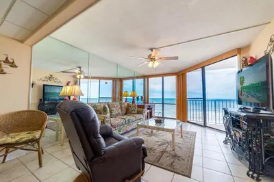 a living room with a view of the ocean at Edgewater W404 'Sandpiper' in Panama City Beach