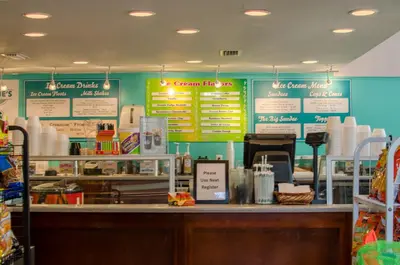 a fast food restaurant with signs on the wall at Edgewater 2-0811 'Beach Lovers Paradise' in Panama City Beach