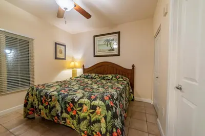 a bedroom with a bed and a ceiling fan at Shores of Panama 0801 'Panama Dreamin' in Panama City Beach