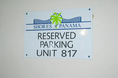 a sign that reads reserved parking unit at Shores of Panama 0817 'Sunset Lagoon' in Panama City Beach