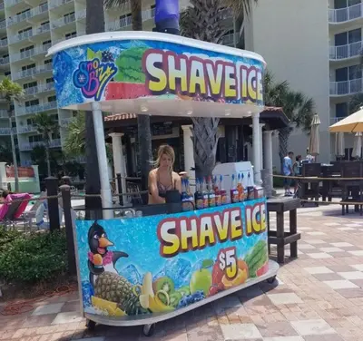 a sign for a drink stand at a beach at Shores of Panama 0817 'Sunset Lagoon' in Panama City Beach
