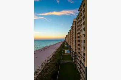 a view of the beach from the balcony of a building at Shores of Panama 0817 'Sunset Lagoon' in Panama City Beach