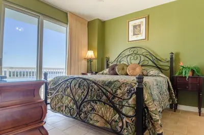a bedroom with a bed and a window with a view at Seychelles 1801 'Turtle Cay' in Panama City Beach