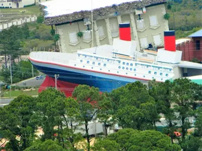 a large cruise ship parked next to a building at Seychelles 1801 'Turtle Cay' in Panama City Beach