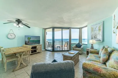 a living room with a view of the ocean at Sunbird 509E 'Window on the Gulf' in Panama City Beach