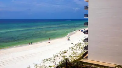 a view of a beach with people and the ocean at Mariner West 606 'Beach Happy' in Panama City Beach