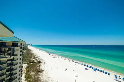 a view of a beach with a building and the ocean at Sunbird 1205W 'Compass Rose Penthouse' in Panama City Beach