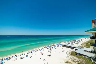 an aerial view of a beach with people at Sunbird 1205W 'Compass Rose Penthouse' in Panama City Beach