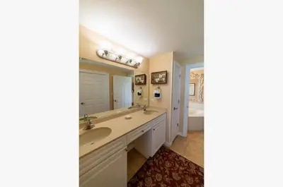 a bathroom with two sinks and a tub at Boardwalk 1111 'Admiral's Quarters' in Panama City Beach