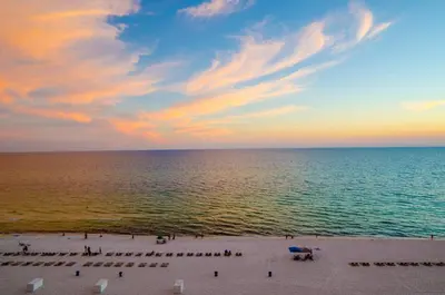 a view of the beach at sunset at Watercrest 1004 'Neptune's Reef' in Panama City Beach