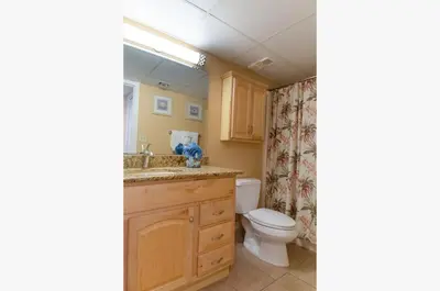 a bathroom with a toilet and a sink at Watercrest 1507 'Mermaid's Hideaway' in Panama City Beach