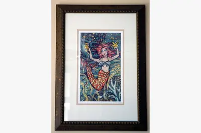 a painting of a woman with a mermaid at Watercrest 1507 'Mermaid's Hideaway' in Panama City Beach