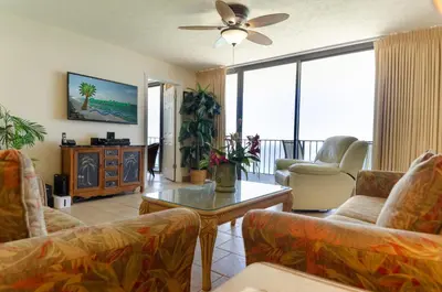 a living room with couches and a ceiling fan at Watercrest 1507 'Mermaid's Hideaway' in Panama City Beach