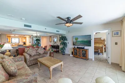 a living room with a couch and a ceiling fan at Watercrest 1507 'Mermaid's Hideaway' in Panama City Beach