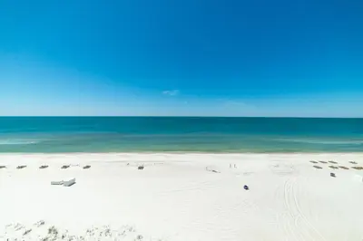 a white beach with the ocean in the background at Edgewater W608 'Sea Forever' in Panama City Beach