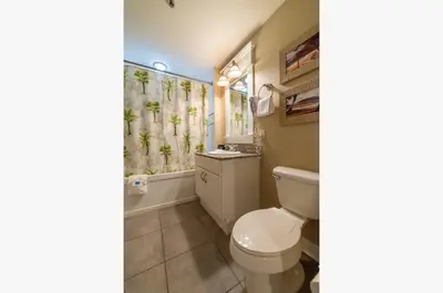 a bathroom with a toilet and a shower at Grand Panama 1-1803 'Panama Paradise' in Panama City Beach