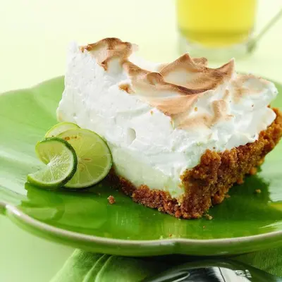 a slice of lime cake on a green plate at Sunbird 908E 'High Tides' in Panama City Beach