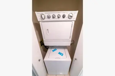 a white stove top oven sitting in a room at Edgewater W607 'Seas The Day' in Panama City Beach