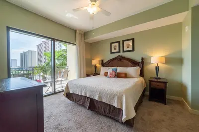 a bedroom with a bed and a large window at Origin 631 'Sea La Vie' in Panama City Beach