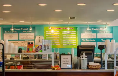 a fast food restaurant with signs on the wall at Edgewater 3-0413 'Once Upon A Tide' in Panama City Beach
