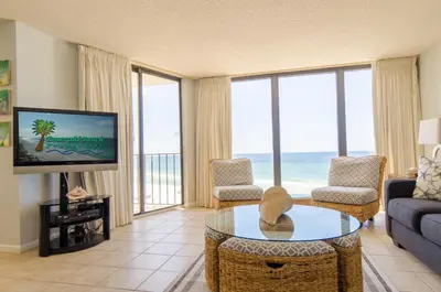 a living room with a view of the ocean at Edgewater 3-0413 'Once Upon A Tide' in Panama City Beach