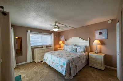 a bedroom with a bed and a ceiling fan at Regency Towers 1122 'Seas The Day' in Panama City