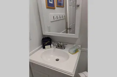 a bathroom with a sink and a mirror at Oceanfront Paradise - Beach at your backdoor!! in Panama City Beach