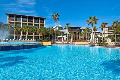 a large swimming pool in front of a resort at Daze Gone Bye in Panama City Beach