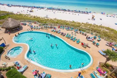 an overhead view of a swimming pool next to a beach at Emerald Beach 1535 in Panama City Beach