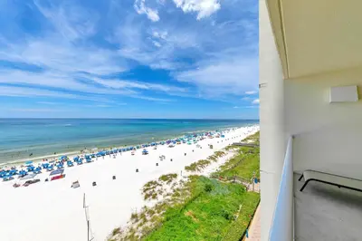 a view of a beach with umbrellas and the ocean at Majestic Beach Towers 1-609 in Panama City Beach
