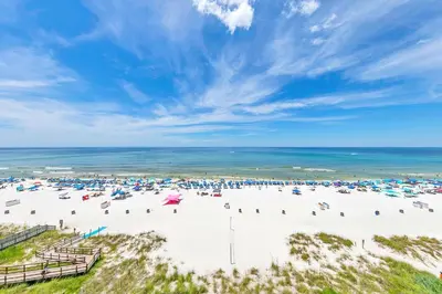 an overhead view of a beach with umbrellas and the ocean at Majestic Beach Towers 1-609 in Panama City Beach