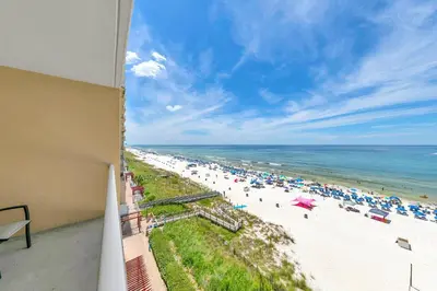 a view of a beach with umbrellas and the ocean at Majestic Beach Towers 1-609 in Panama City Beach