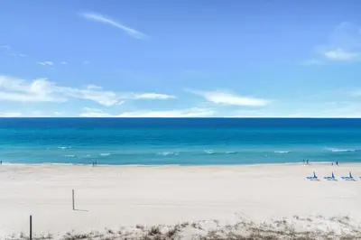 a beach with the ocean in the background at Aquavista 404E in Panama City Beach
