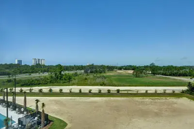 an aerial view of a large park with palm trees at TownePlace Suites by Marriott Panama City Beach Pier Park in Panama City Beach