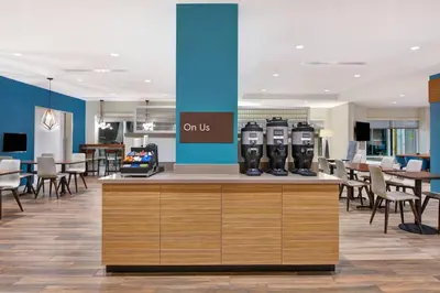 a waiting area with two parking meters on a counter at TownePlace Suites by Marriott Panama City Beach Pier Park in Panama City Beach