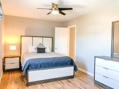 a bedroom with a bed and a ceiling fan at 5218 Beach Dr B in Panama City Beach