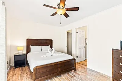 a bedroom with a bed and a ceiling fan at 5218 Beach Dr C in Panama City Beach