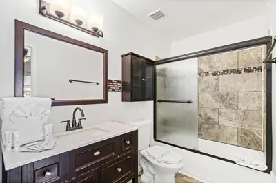a bathroom with a shower and a toilet and a sink at 5218 Beach Dr C in Panama City Beach