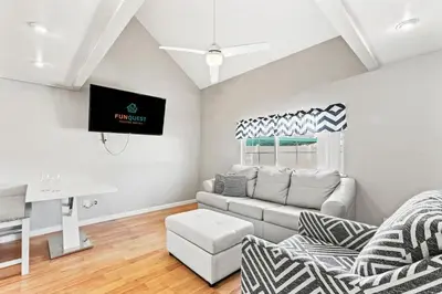 a living room with a couch and a tv at 5218 Beach Dr C in Panama City Beach
