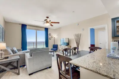 a living room with a view of the ocean at Sterling Reef 802 in Panama City Beach