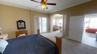 a bedroom with a bed and a ceiling fan at Marisol 1001 in Panama City Beach