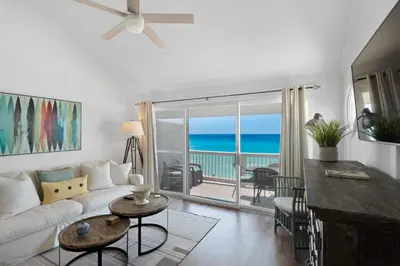 a living room with a couch and a view of the ocean at Mistral Unit 18 in Santa Rosa Beach
