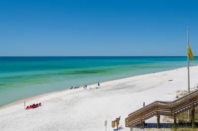 a group of people on a beach near the ocean at Mistral Unit 18 in Santa Rosa Beach