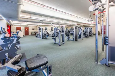 a gym with lots of treadmills and machines at Majestic Beach Towers 1-1803 in Panama City Beach