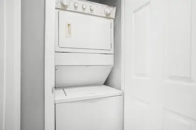 a white refrigerator with its door open in a kitchen at Beachside Villas 732- Southbound Serenity in Santa Rosa Beach