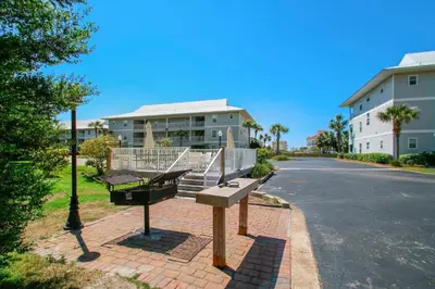 a couple of benches on the side of a street at Beachside Villas 732- Southbound Serenity in Santa Rosa Beach