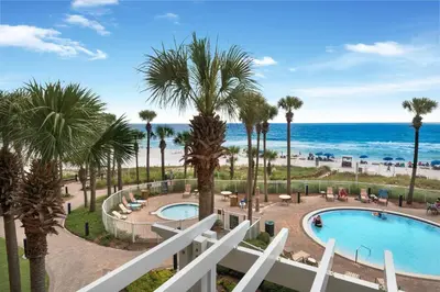a view of the beach from the balcony of a resort at Grand Panama 1-305 in Panama City Beach