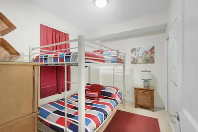 a bedroom with a bunk bed with a ladder at Marisol 501 in Panama City Beach